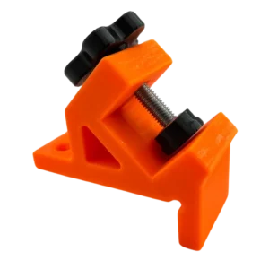 Zacisk do płytek umożliwiający precyzyjne ukosowanie i stabilne mocowanie podczas obróbki